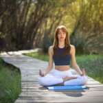 young-beautiful-woman-doing-yoga-nature-expertateverything
